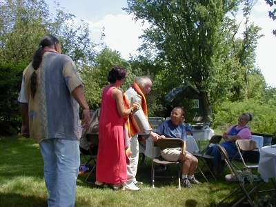 Stephanie Autumn and Clyde Bellecourt honoring Doug with Indian blanket