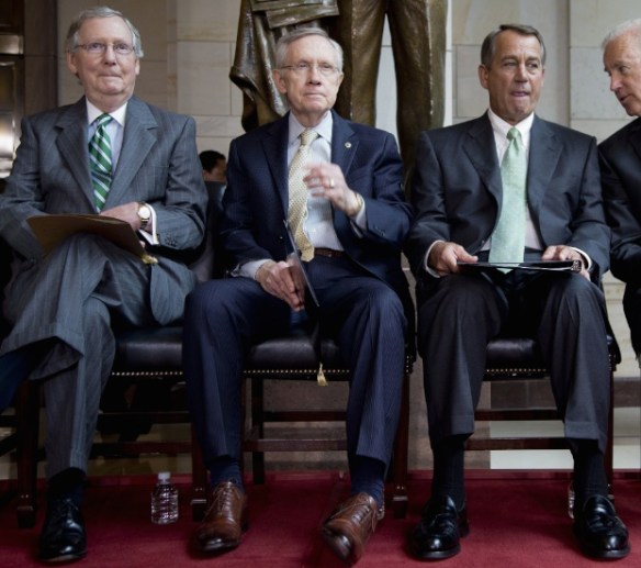 Sen. Mitch McConnell, Sen. Harry Reid (with the turned-in left foot), and Speaker of the House John Boehner.