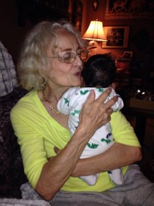 Great grandma singing "Itsy bits spider" to Seylon's newborn child.