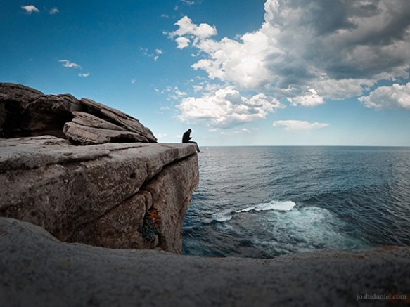Self-portrait of joshi daniel sitting on the cliff by Bondi beach in Sydney, New South Wales, Australia
