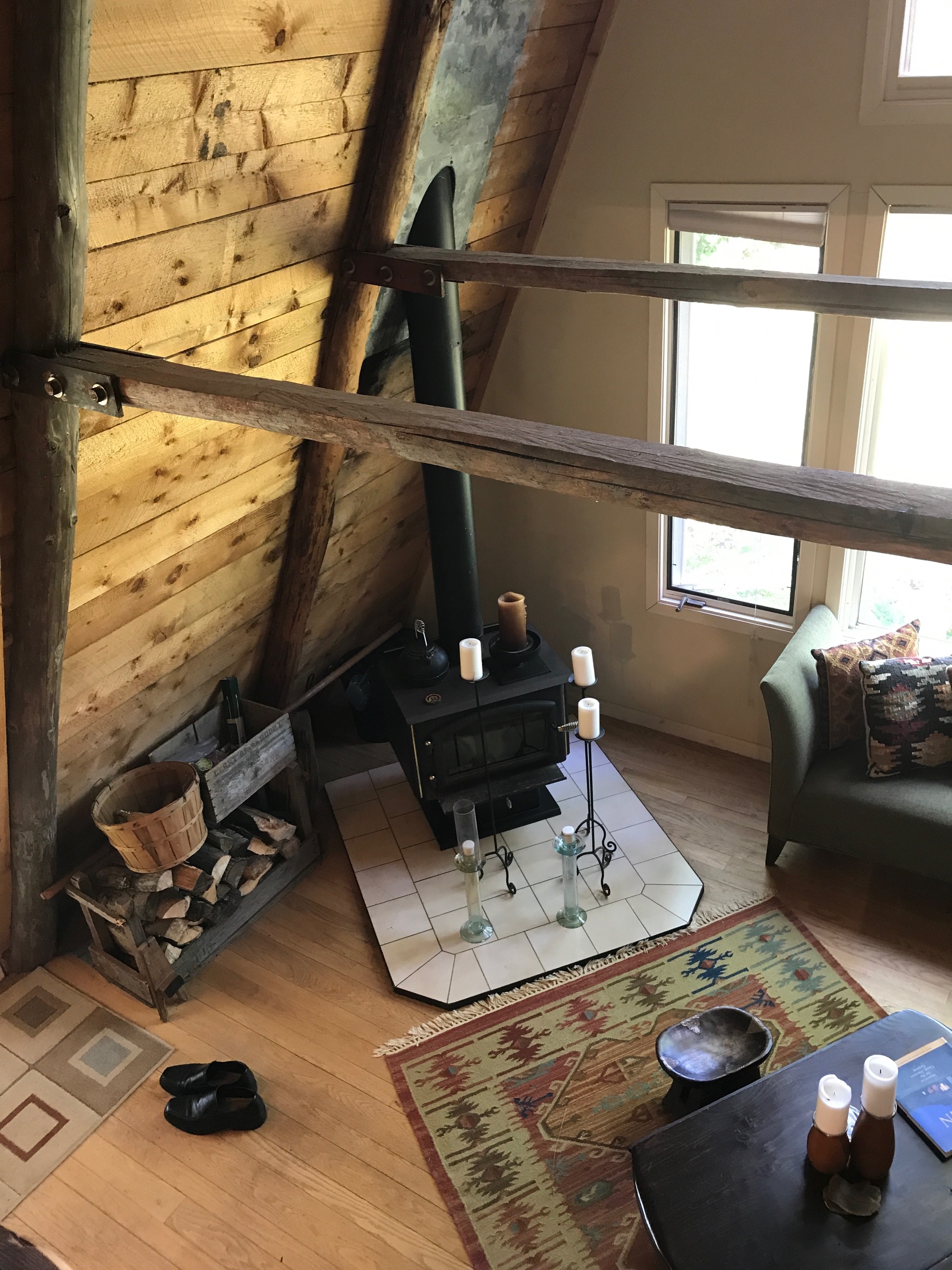 photograph of cabin by the wetland showing orange wall with morning light.